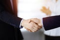 Business people shaking hands at meeting or negotiation, close-up. Group of unknown businessmen and a woman stand Royalty Free Stock Photo