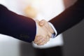 Business people shaking hands at meeting or negotiation, close-up. Group of unknown businessmen and a woman stand Royalty Free Stock Photo