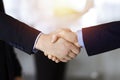 Business people shaking hands at meeting or negotiation, close-up. Group of unknown businessmen and a woman stand Royalty Free Stock Photo