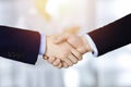 Business people shaking hands at meeting or negotiation, close-up. Group of unknown businessmen and a woman stand Royalty Free Stock Photo