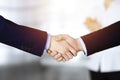 Business people shaking hands at meeting or negotiation, close-up. Group of unknown businessmen and a woman stand Royalty Free Stock Photo