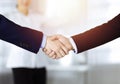 Business people shaking hands at meeting or negotiation, close-up. Group of unknown businessmen and a woman stand Royalty Free Stock Photo