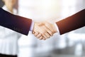 Business people shaking hands at meeting or negotiation, close-up. Group of unknown businessmen and a woman stand Royalty Free Stock Photo