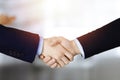 Business people shaking hands at meeting or negotiation, close-up. Group of unknown businessmen and a woman stand Royalty Free Stock Photo