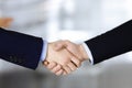 Business people shaking hands at meeting or negotiation, close-up. Group of unknown businessmen and a woman standing in Royalty Free Stock Photo