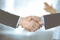 Business people shaking hands at meeting or negotiation, close-up. Group of unknown businessmen and a woman standing in Royalty Free Stock Photo