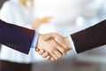 Business people shaking hands at meeting or negotiation, close-up. Group of unknown businessmen and a woman standing in Royalty Free Stock Photo