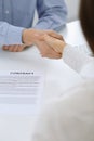 Business people shaking hands at meeting or negotiation after contract discussing. Businessman and woman handshake at Royalty Free Stock Photo