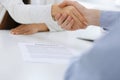 Business people shaking hands at meeting or negotiation after contract discussing. Businessman and woman handshake at Royalty Free Stock Photo