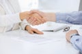 Business people shaking hands at meeting or negotiation after contract discussing. Businessman and woman handshake at Royalty Free Stock Photo