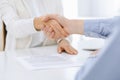 Business people shaking hands at meeting or negotiation after contract discussing. Businessman and woman handshake at Royalty Free Stock Photo