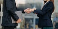 Business people shaking hands during a meeting. Two happy mature businessmen and woman Royalty Free Stock Photo