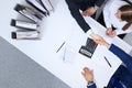 Business people shaking hands at meeting, view from above. Bookkeeper or financial inspector making report, calculatin Royalty Free Stock Photo