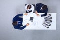 Business people shaking hands at meeting, view from above. Bookkeeper or financial inspector making report, calculatin Royalty Free Stock Photo