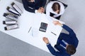 Business people shaking hands at meeting, view from above. Bookkeeper or financial inspector making report, calculatin Royalty Free Stock Photo