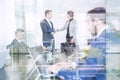 Business people shaking hands in moder corporate office. Royalty Free Stock Photo