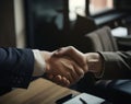 Business people shaking hands in office, close shot