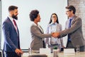 Business people shaking hands in the office. Royalty Free Stock Photo