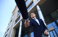 Business people shaking hands outside modern office building. Royalty Free Stock Photo