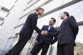 Business people shaking hands outside office Royalty Free Stock Photo