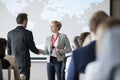 Business people shaking hands during seminar Royalty Free Stock Photo