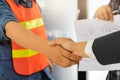 Business people shaking hands after successful building construction planning project Royalty Free Stock Photo