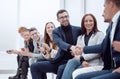 business people shaking hands to the applause of the business team Royalty Free Stock Photo