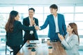 Business people shaking hands. Young modern man and woman in smart casual wear shaking hands. Royalty Free Stock Photo