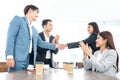Business people shaking hands. Young modern man and woman in smart casual wear shaking hands. Royalty Free Stock Photo