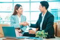 Business people shaking hands. Young modern man and woman in smart casual wear shaking hands . Royalty Free Stock Photo