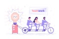 Business people are sitting on the bicycle and generating electric power for a large bulb. Idea generation. Brainstorm and