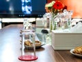 Business people sitting on a table for conference with cookies glass and jar of water placed on wooden table Royalty Free Stock Photo