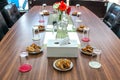 Business people sitting on a table for conference with cookies glass and jar of water placed on wooden table Royalty Free Stock Photo