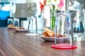 Business people sitting on a table for conference with cookies glass and jar of water placed on wooden table Royalty Free Stock Photo