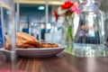 Business people sitting on a table for conference with cookies glass and jar of water placed on wooden table Royalty Free Stock Photo