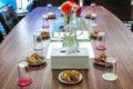 Business people sitting on a table for conference with cookies glass and jar of water placed on wooden table Royalty Free Stock Photo