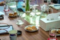 Business people sitting on a table for conference with cookies glass and jar of water placed on wooden table Royalty Free Stock Photo