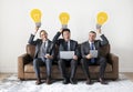 Business people sitting together with icons Royalty Free Stock Photo