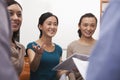 Business people smiling and having meeting in the office, gesturing Royalty Free Stock Photo