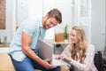 Business people smiling and working together with a laptop Royalty Free Stock Photo