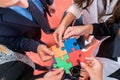 Business people solving jigsaw puzzle. Royalty Free Stock Photo