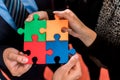 Business people solving jigsaw puzzle. Royalty Free Stock Photo