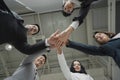 business people stacking hands together in teamwork Royalty Free Stock Photo