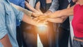 Business people stacking hands together to cheer up team spirit Royalty Free Stock Photo