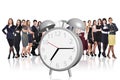 Business people stand near big alarm clock Royalty Free Stock Photo