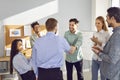 Business people standing in office making deal. Two men shaking hands finishing meeting. Royalty Free Stock Photo