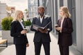 Business people standing and talk to each other in front of modern office Royalty Free Stock Photo