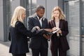 Business people standing and talk to each other in front of modern office Royalty Free Stock Photo