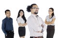 Business people stands with folded arms on studio Royalty Free Stock Photo