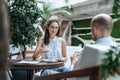 business people talk at an informal meeting in a cafe . Royalty Free Stock Photo